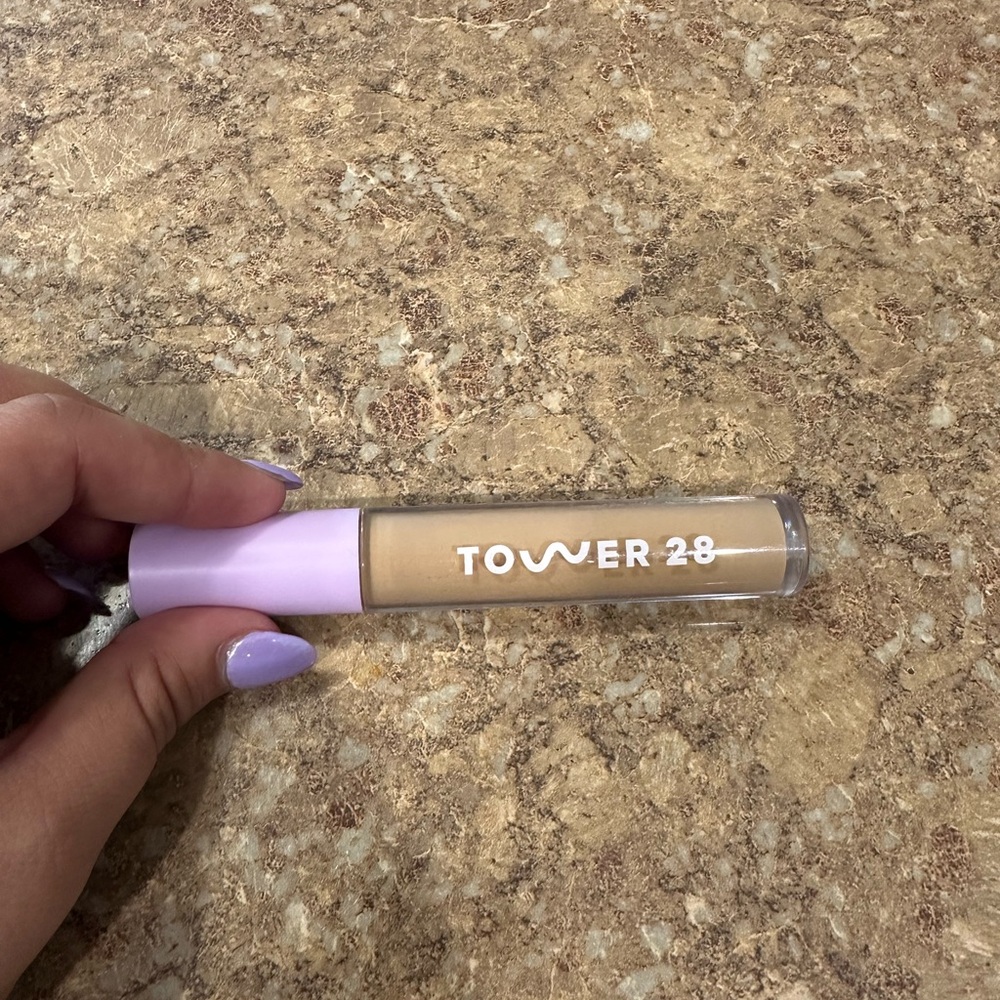 Tower 28 Cream and Purple Concealer Color: Pali tan with medium neutral